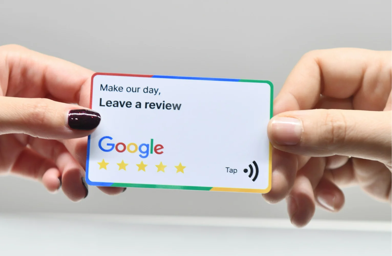 A Google review card being handed out to a client